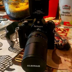 Nikon professional photography camera with the carry bag,2 films,and a extra len
